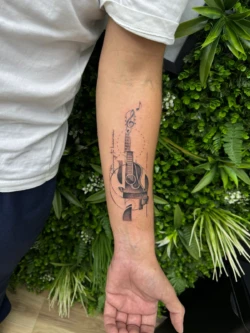 Tatouage Guitare et note de musique